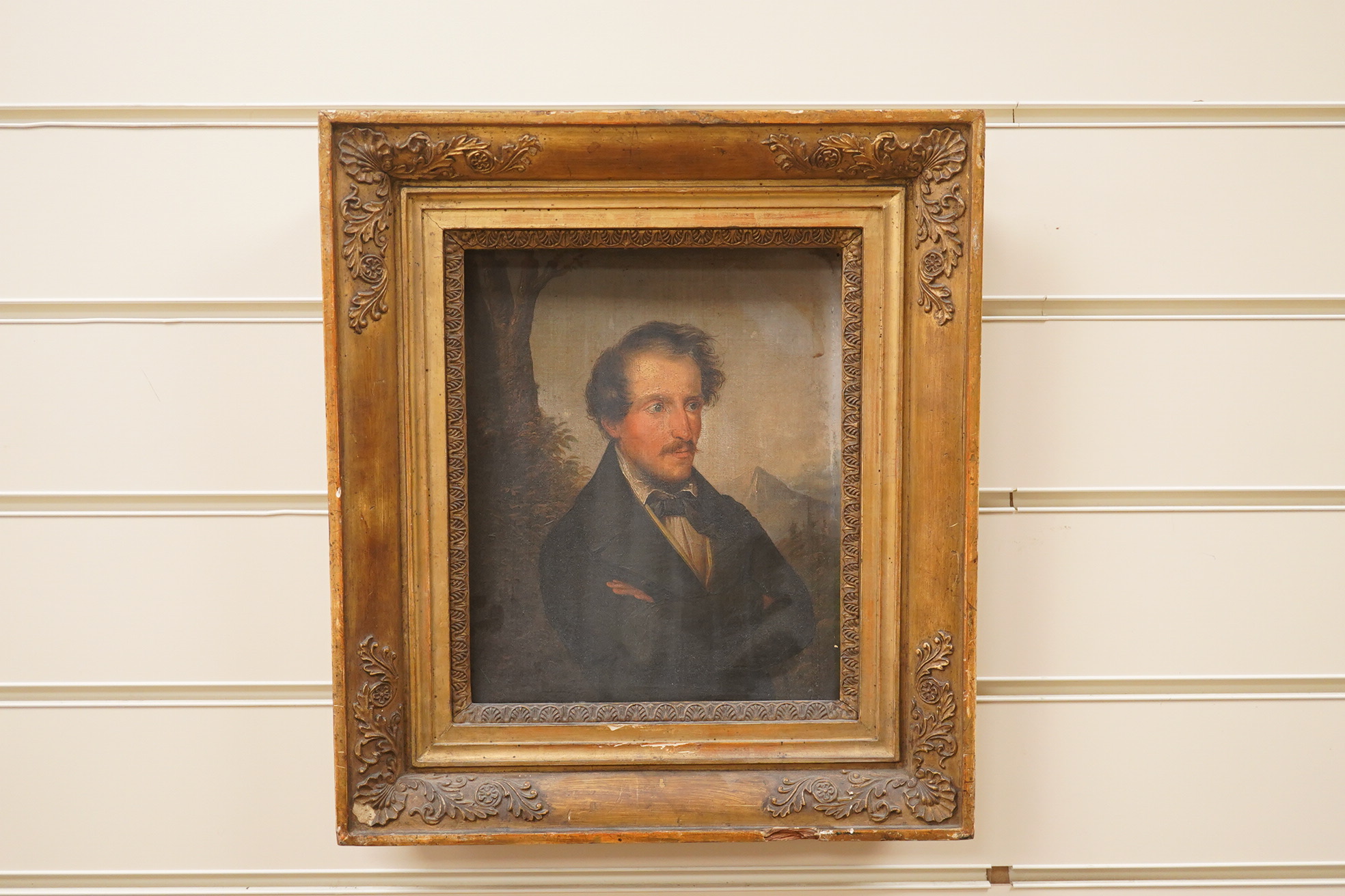 Mid Victorian School, Portrait of a gentleman before a landscape, unsigned, 23 x 19cm, ornate gilt framed. Condition - fair